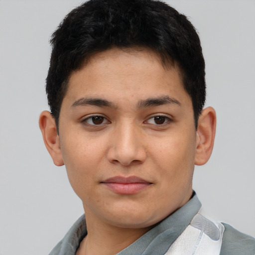 Joyful latino young-adult male with short  brown hair and brown eyes
