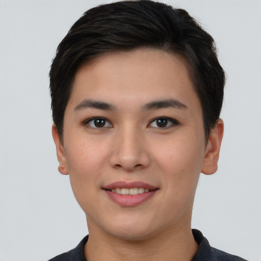 Joyful asian young-adult female with short  brown hair and brown eyes