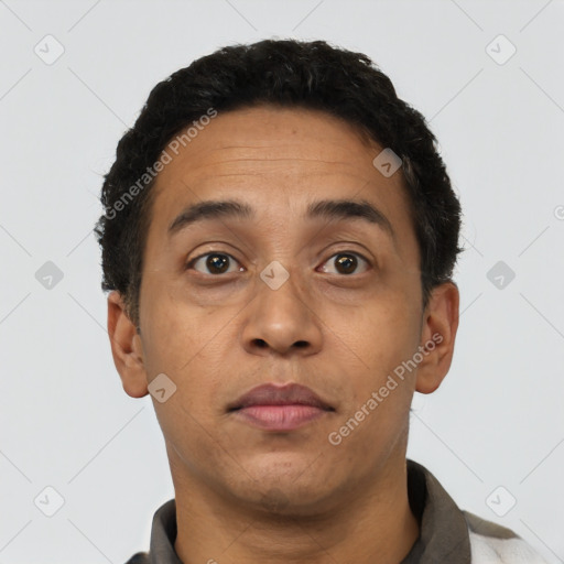 Neutral latino adult male with short  brown hair and brown eyes