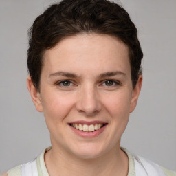 Joyful white young-adult female with short  brown hair and grey eyes