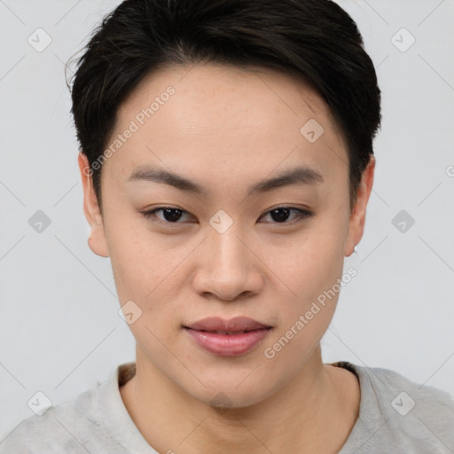 Joyful asian young-adult female with short  brown hair and brown eyes