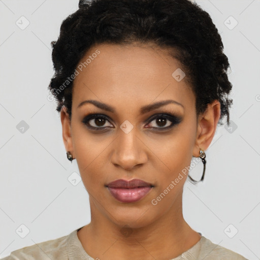 Joyful black young-adult female with short  black hair and brown eyes