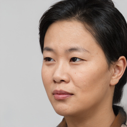 Neutral asian young-adult female with short  brown hair and brown eyes