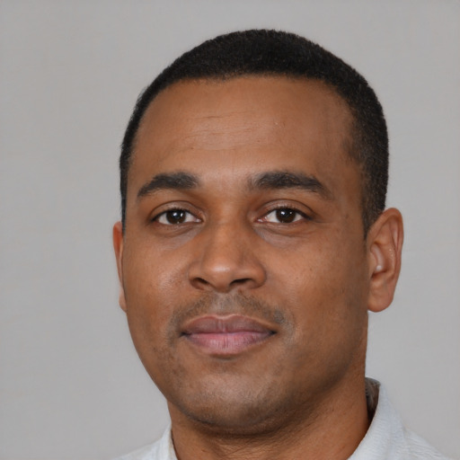 Neutral black young-adult male with short  black hair and brown eyes