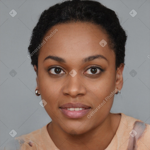 Joyful black young-adult female with short  black hair and brown eyes