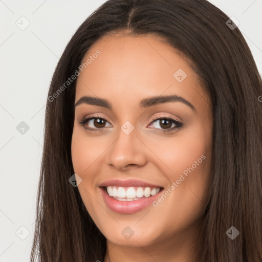 Joyful latino young-adult female with long  brown hair and brown eyes