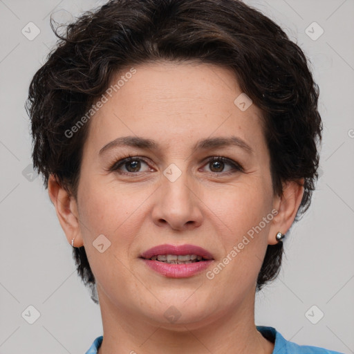 Joyful white adult female with short  brown hair and brown eyes