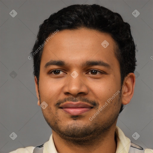 Joyful latino young-adult male with short  black hair and brown eyes