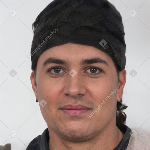 Joyful white young-adult male with short  black hair and brown eyes