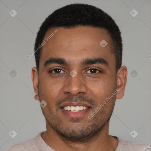 Joyful black young-adult male with short  black hair and brown eyes