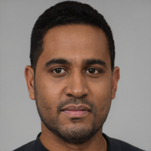 Neutral black young-adult male with short  black hair and brown eyes