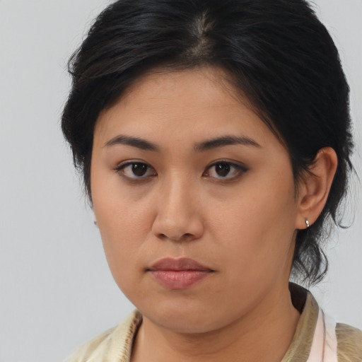Neutral asian young-adult female with medium  brown hair and brown eyes