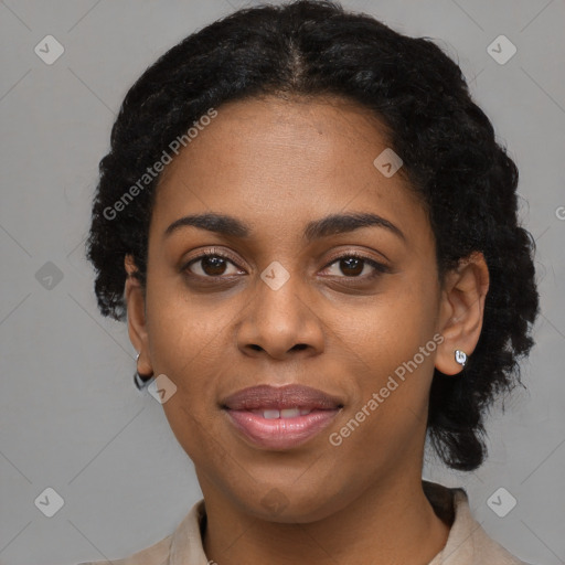 Joyful black young-adult female with short  black hair and brown eyes