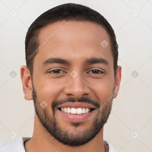 Joyful white young-adult male with short  black hair and brown eyes