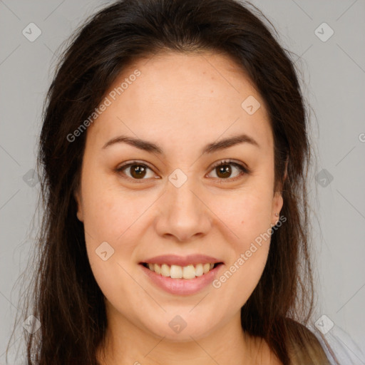 Joyful white young-adult female with long  brown hair and brown eyes