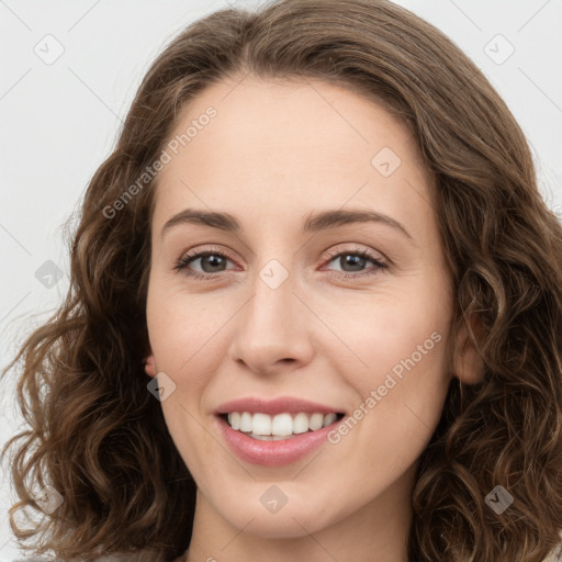 Joyful white young-adult female with long  brown hair and green eyes