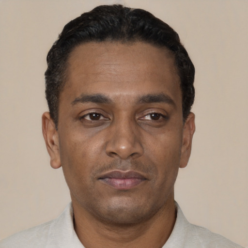 Neutral black young-adult male with short  black hair and brown eyes