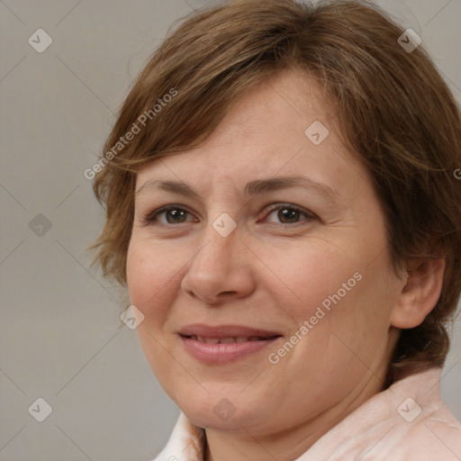 Joyful white adult female with medium  brown hair and brown eyes