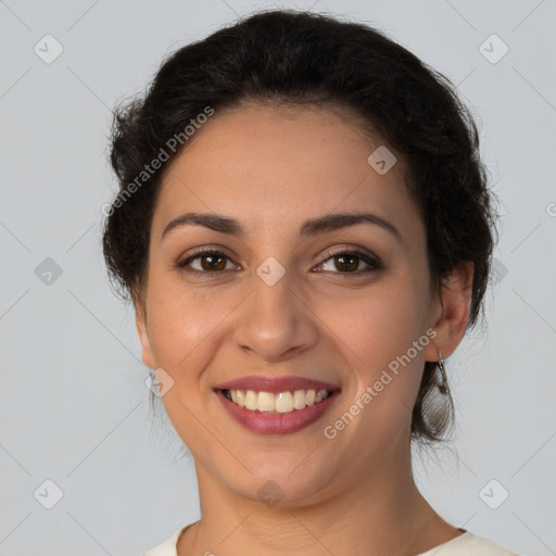 Joyful latino young-adult female with medium  brown hair and brown eyes