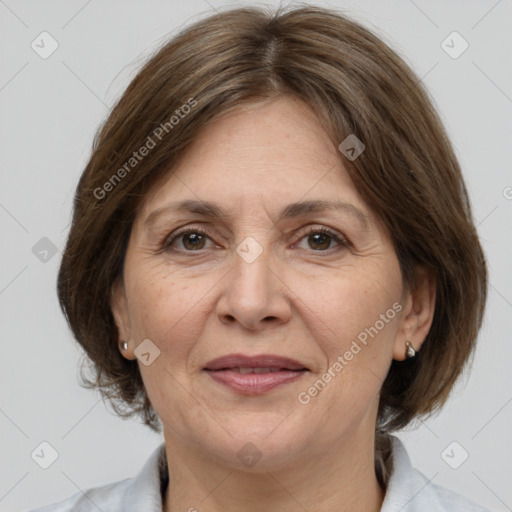 Joyful white adult female with medium  brown hair and brown eyes