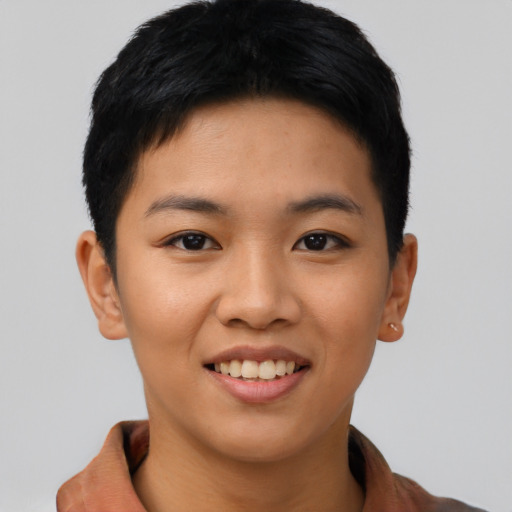 Joyful asian young-adult female with short  brown hair and brown eyes