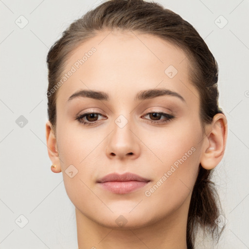 Neutral white young-adult female with long  brown hair and brown eyes