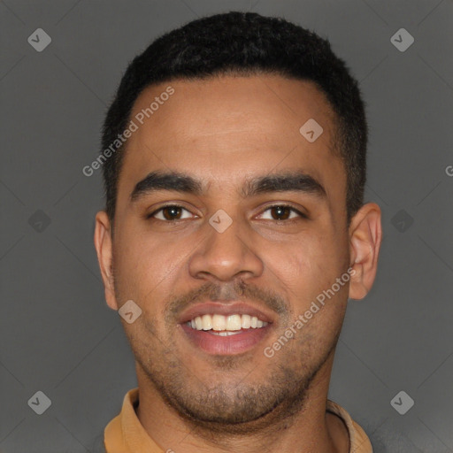 Joyful black young-adult male with short  brown hair and brown eyes