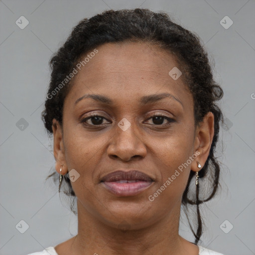 Joyful black adult female with short  brown hair and brown eyes