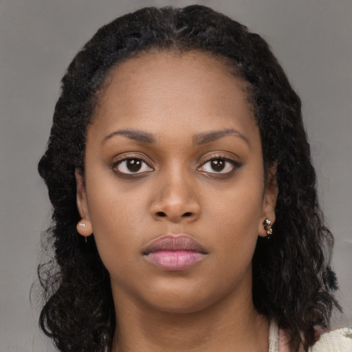 Neutral black young-adult female with long  black hair and brown eyes