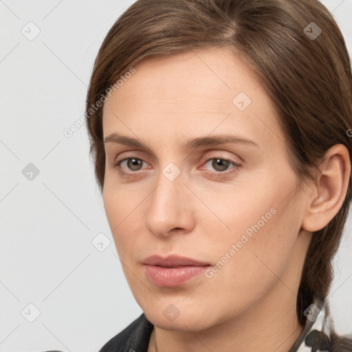 Neutral white young-adult female with medium  brown hair and grey eyes