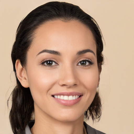 Joyful white young-adult female with long  brown hair and brown eyes