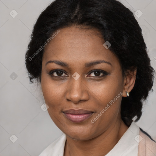 Joyful black adult female with medium  brown hair and brown eyes