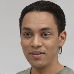 Joyful white young-adult male with short  black hair and brown eyes