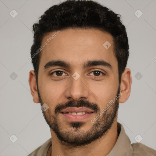 Joyful latino young-adult male with short  black hair and brown eyes