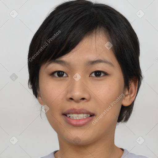 Joyful asian young-adult female with medium  black hair and brown eyes