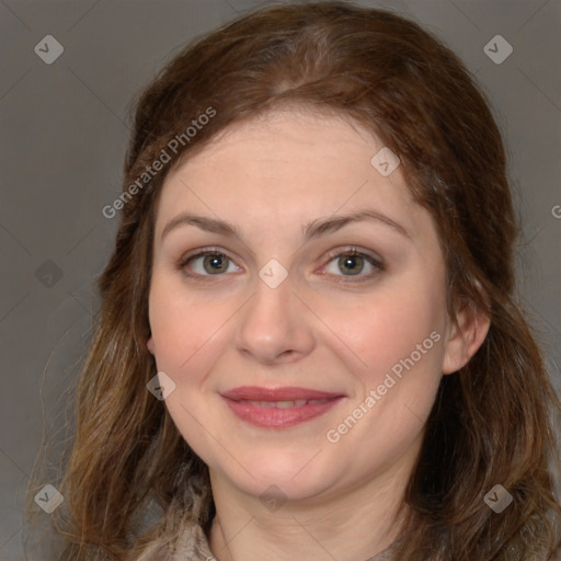 Joyful white young-adult female with long  brown hair and green eyes