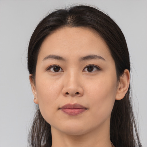 Neutral asian young-adult female with medium  brown hair and brown eyes