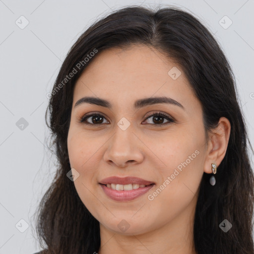 Joyful latino young-adult female with long  brown hair and brown eyes