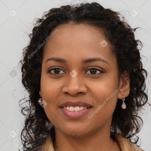 Joyful black young-adult female with long  brown hair and brown eyes