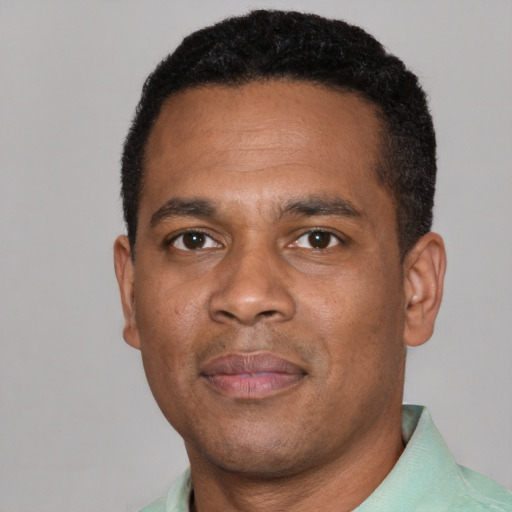 Neutral black young-adult male with short  black hair and brown eyes