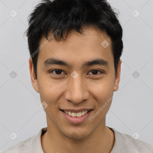 Joyful asian young-adult male with short  black hair and brown eyes