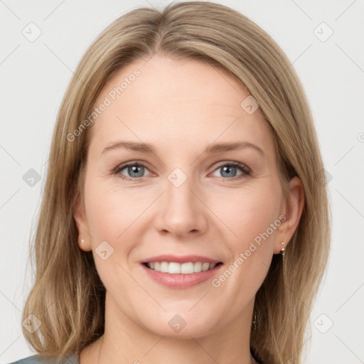 Joyful white young-adult female with long  brown hair and blue eyes