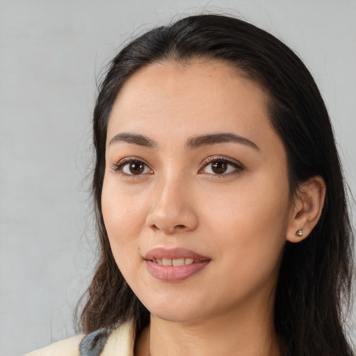 Joyful white young-adult female with long  black hair and brown eyes