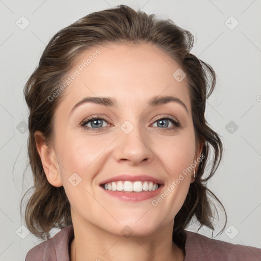 Joyful white young-adult female with medium  brown hair and blue eyes