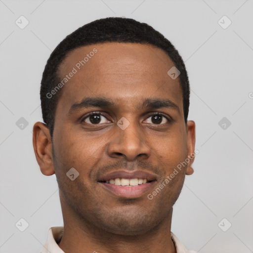 Joyful black young-adult male with short  brown hair and brown eyes