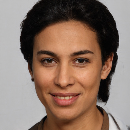 Joyful white young-adult female with medium  brown hair and brown eyes