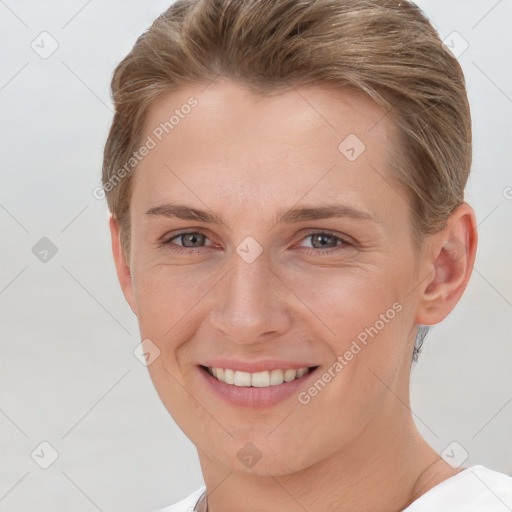 Joyful white young-adult female with short  brown hair and grey eyes