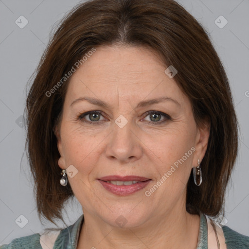 Joyful white adult female with medium  brown hair and grey eyes