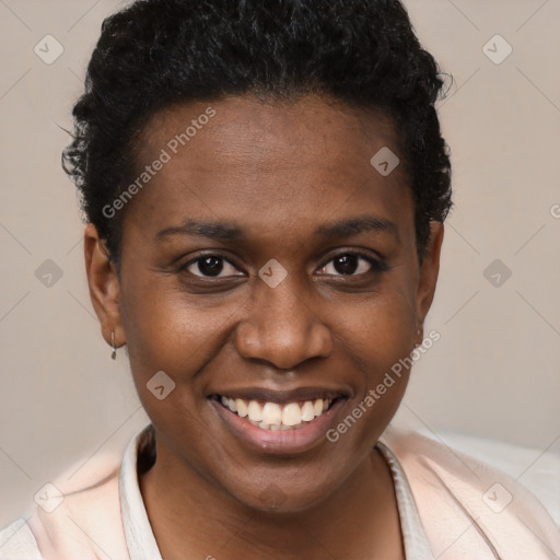 Joyful black young-adult female with short  brown hair and brown eyes