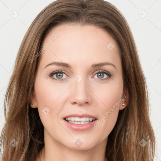 Joyful white young-adult female with long  brown hair and grey eyes